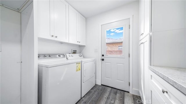 washroom featuring cabinet space, attic access, independent washer and dryer, and wood finished floors