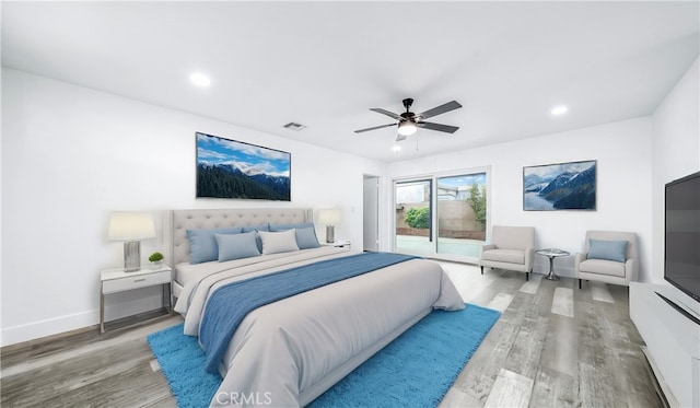 bedroom featuring wood finished floors, baseboards, recessed lighting, ceiling fan, and access to outside