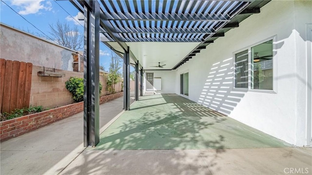 view of patio / terrace with a ceiling fan, a fenced backyard, and a pergola