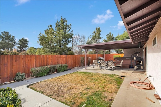 view of yard featuring a patio area and a fenced backyard