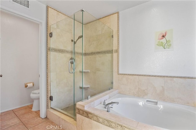 bathroom with visible vents, toilet, a shower stall, tile patterned flooring, and a bath