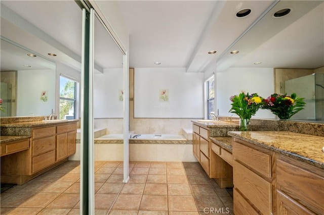 full bathroom with a bath, tile patterned flooring, a healthy amount of sunlight, and a sink