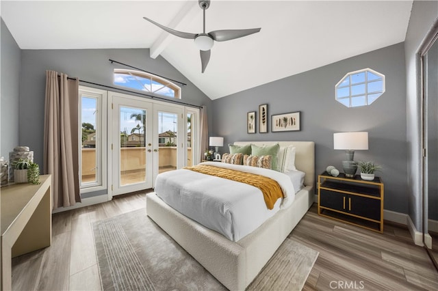 bedroom featuring a ceiling fan, wood finished floors, french doors, access to exterior, and vaulted ceiling with beams