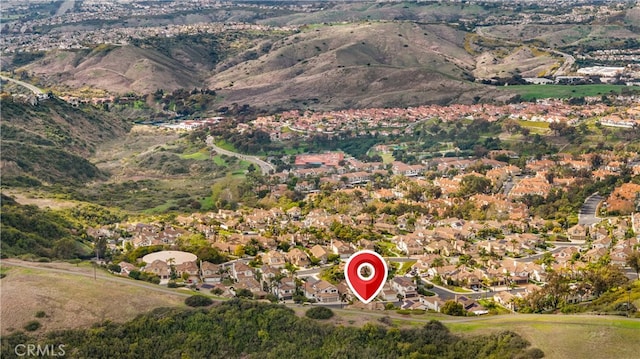 birds eye view of property featuring a mountain view