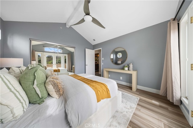 bedroom with light wood finished floors, baseboards, lofted ceiling with beams, french doors, and a ceiling fan