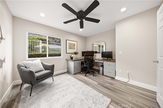 office area featuring recessed lighting, baseboards, light wood-style floors, and a ceiling fan