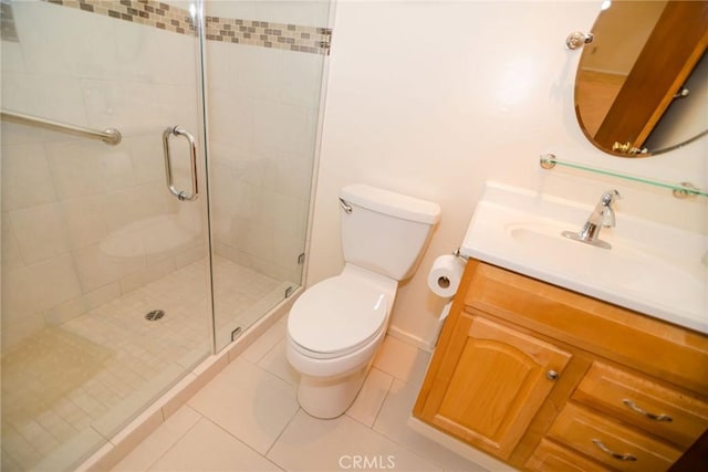 full bathroom with vanity, toilet, a shower stall, and tile patterned flooring