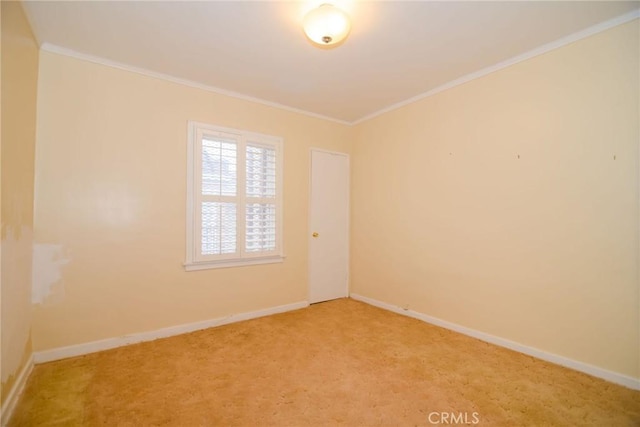 unfurnished room featuring light carpet, baseboards, and ornamental molding