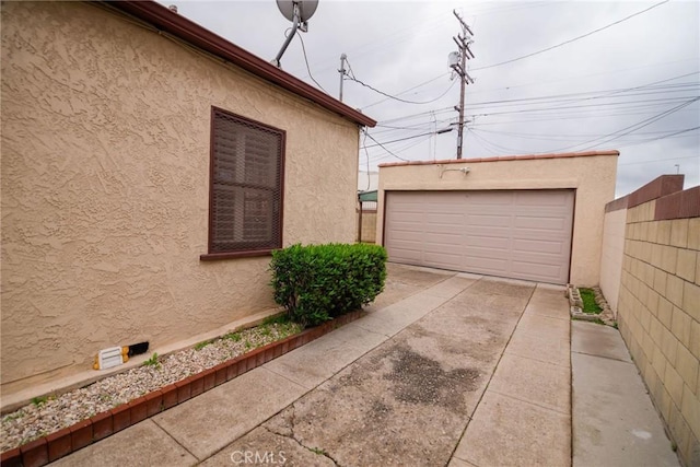 detached garage with fence