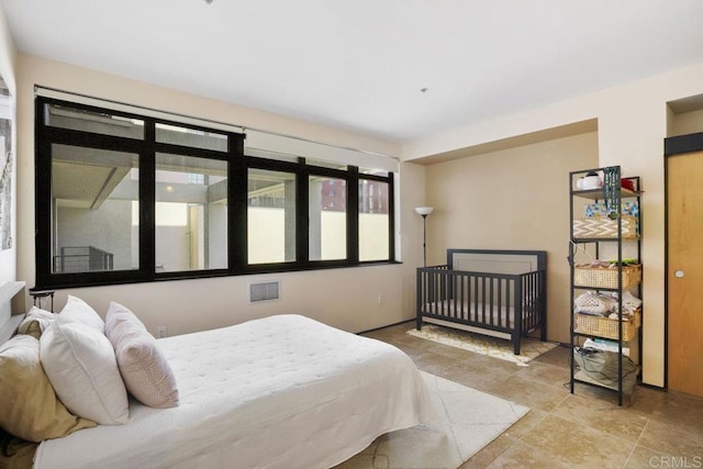 bedroom featuring visible vents