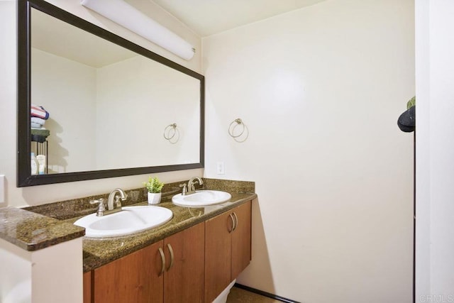 bathroom featuring double vanity and a sink