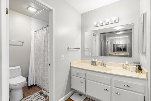 full bathroom featuring vanity, toilet, and wood finished floors