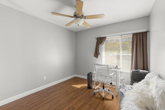 office featuring ceiling fan, baseboards, and wood finished floors