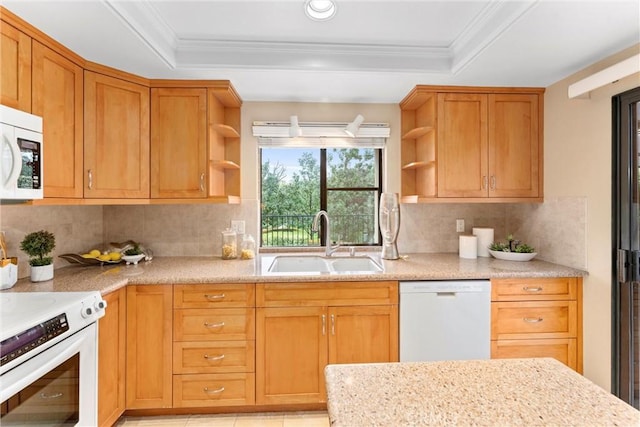 kitchen featuring a raised ceiling, white appliances, open shelves, and a sink