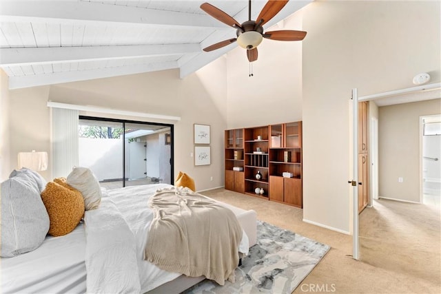 bedroom featuring access to exterior, beam ceiling, light carpet, and baseboards