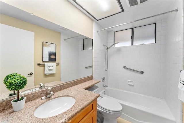 bathroom featuring vanity, toilet, and tub / shower combination