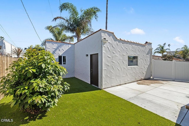 view of outbuilding with fence