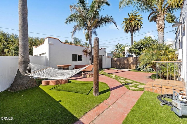 view of yard with a fenced backyard and a patio area