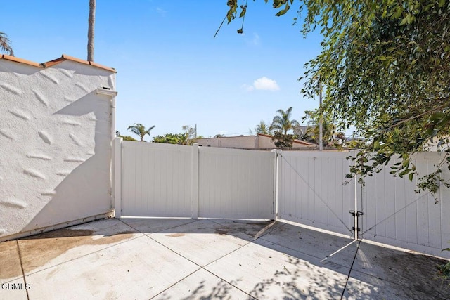 view of patio / terrace with fence and a gate