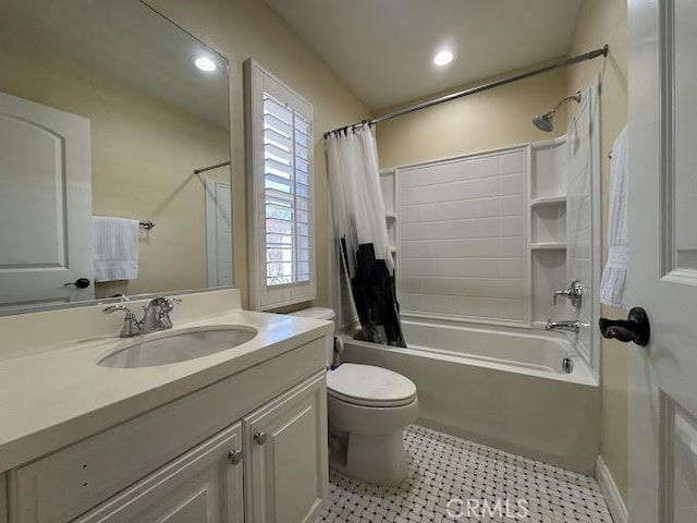 full bathroom with recessed lighting, toilet, vanity, and shower / tub combo