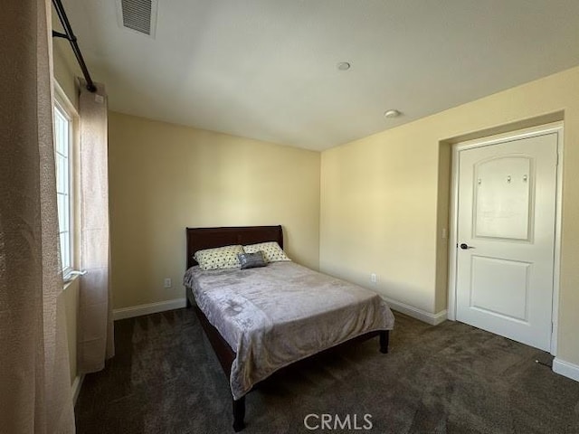 bedroom with visible vents, baseboards, and carpet floors