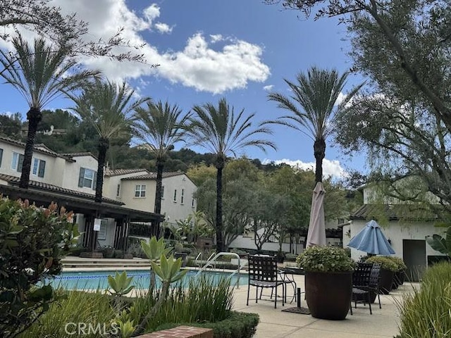 community pool with a patio area