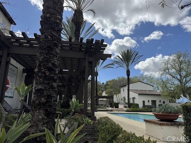 community pool featuring a patio area and a pergola