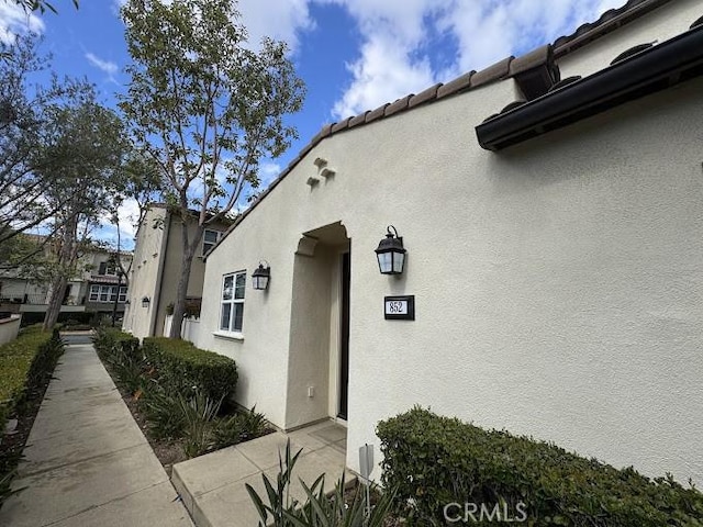 view of home's exterior with stucco siding