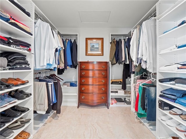 walk in closet featuring attic access