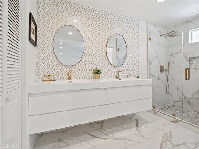 full bathroom featuring vanity, marble finish floor, and a marble finish shower