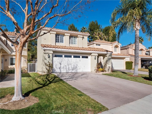 mediterranean / spanish-style house with concrete driveway, a tile roof, a front yard, stucco siding, and a garage