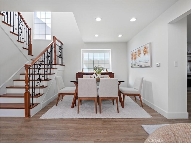 dining area featuring stairway, recessed lighting, wood finished floors, and baseboards