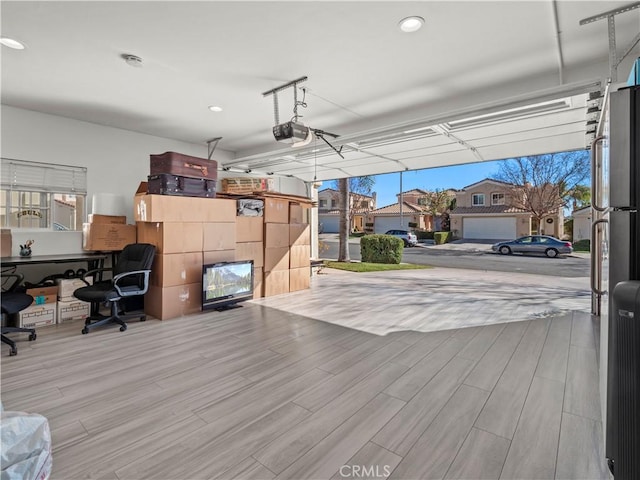 interior space featuring recessed lighting and a garage door opener