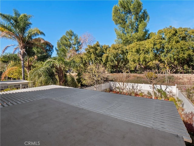 view of patio / terrace featuring fence