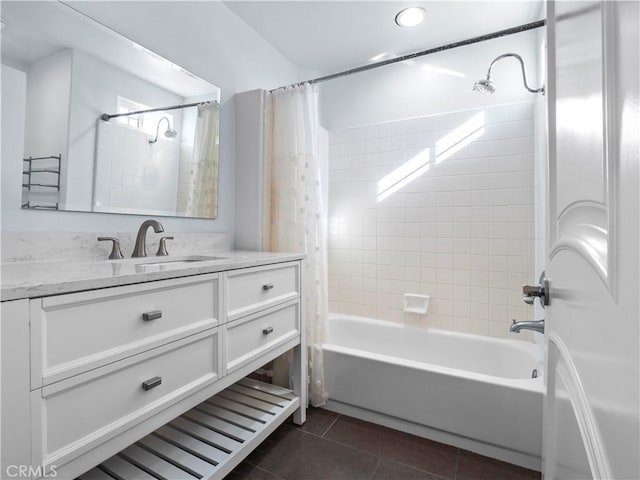 full bath featuring tile patterned floors, vanity, and shower / tub combo