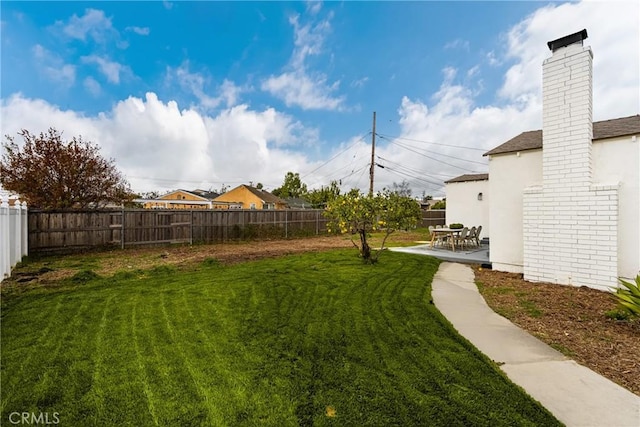 view of yard with a patio and a fenced backyard