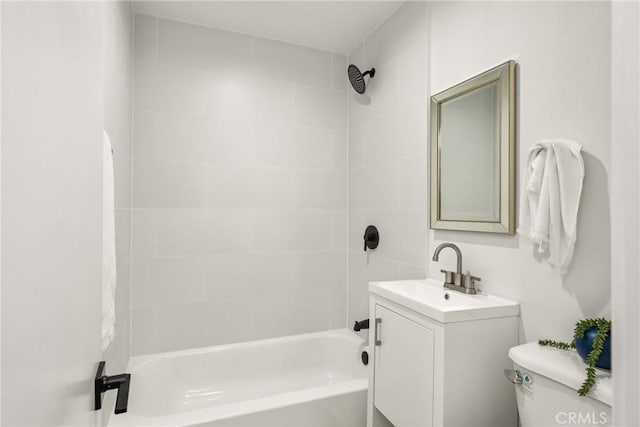 bathroom featuring vanity, toilet, and tub / shower combination