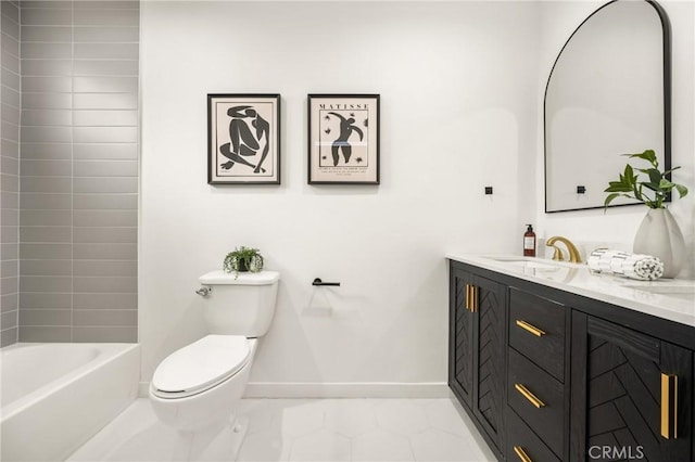 bathroom with baseboards, toilet, and vanity