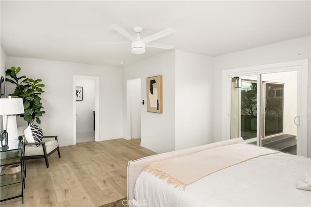 bedroom with a ceiling fan, access to outside, light wood-style floors, and baseboards