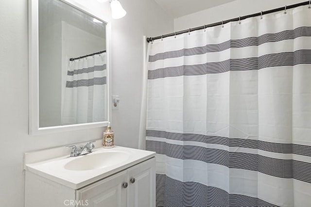 full bath with vanity and a shower with shower curtain