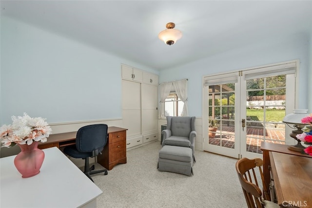 office area with french doors and light carpet