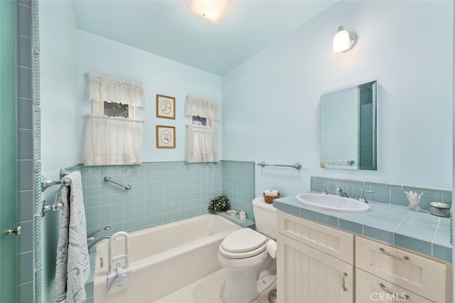 full bath with vanity, a garden tub, toilet, and tile patterned floors