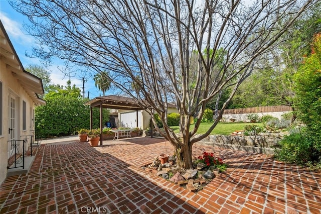 view of patio / terrace with a gazebo and fence