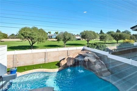 view of swimming pool with a fenced in pool and a fenced backyard