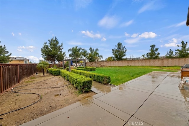 view of yard featuring a patio area and a fenced backyard