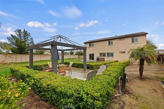 exterior space featuring a gazebo and a fenced backyard