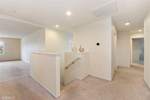 hall featuring light colored carpet, recessed lighting, an upstairs landing, and visible vents