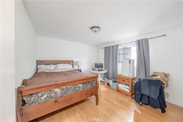 bedroom with light wood-style floors