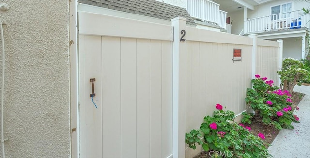 exterior space with roof with shingles