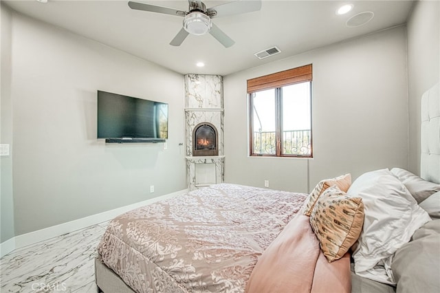 bedroom featuring visible vents, marble finish floor, recessed lighting, a fireplace, and baseboards